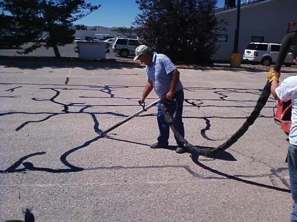 Rubberized hot-pour crack filling on asphalt