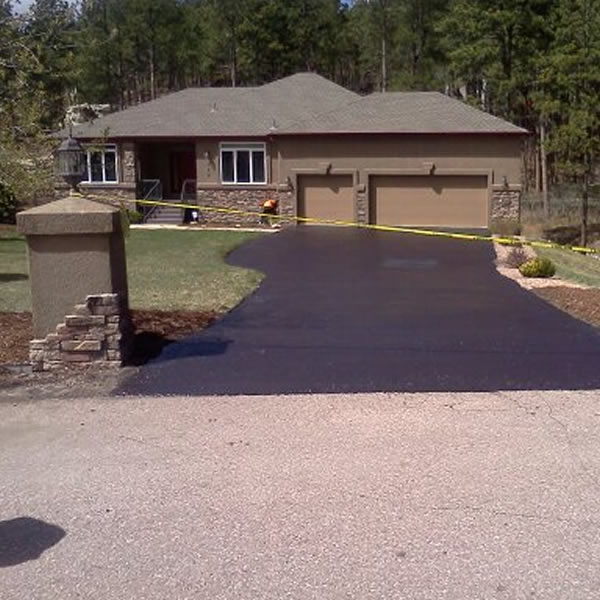 Sloped residential asphalt driveway, Front Range